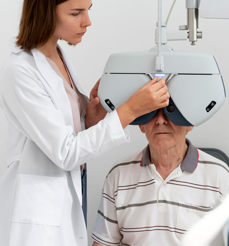 Older man and doctor during eye exam