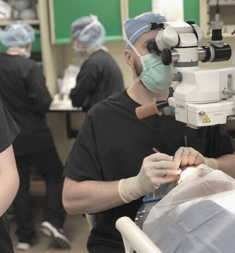 Doctor performing a glaucoma procedure on a patient