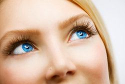 Woman with blue eyes looking up