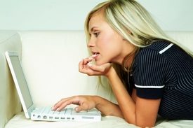 Woman looking at laptop