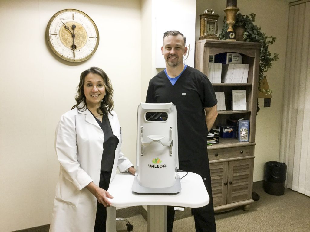 Dr. Prema Abraham, Director of the Retina Center at BHREI, stands with Dr. Niel Brogden, Medical Retinal Optometrist with the new LumiThera Valeda system